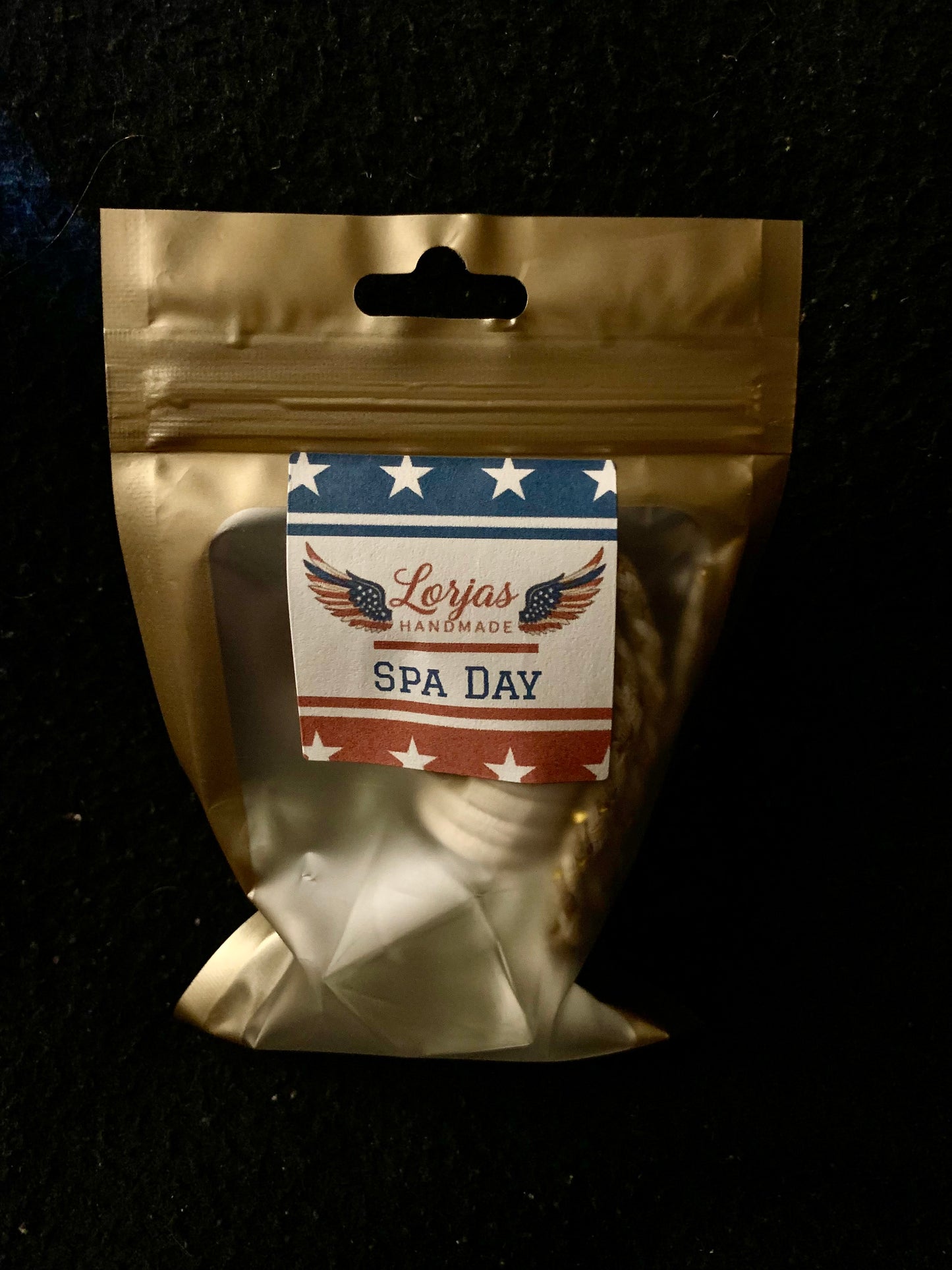 Gold packaging with a LorJas Handmade 'Spa Day' label on a black background