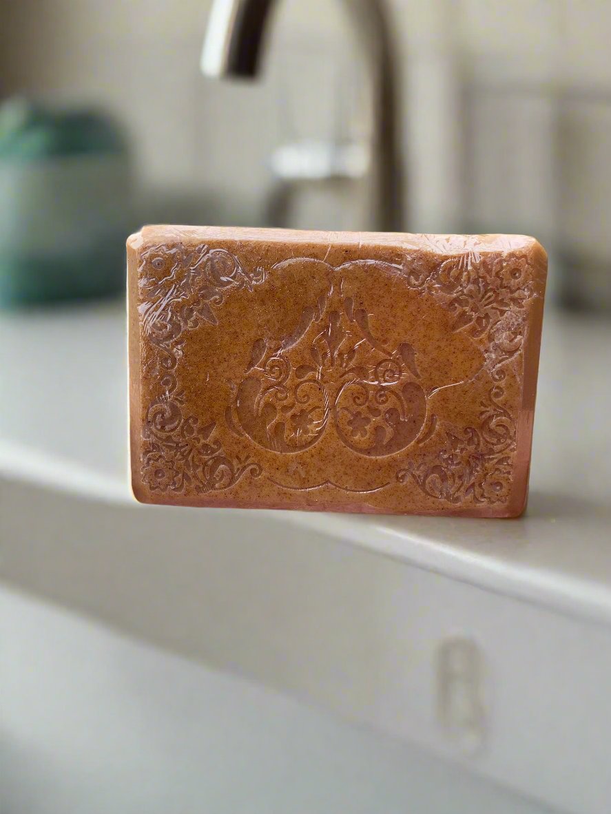 LorJas Handmade 'Turmeric Vanilla' scented goat milk soap with bathroom countertop background