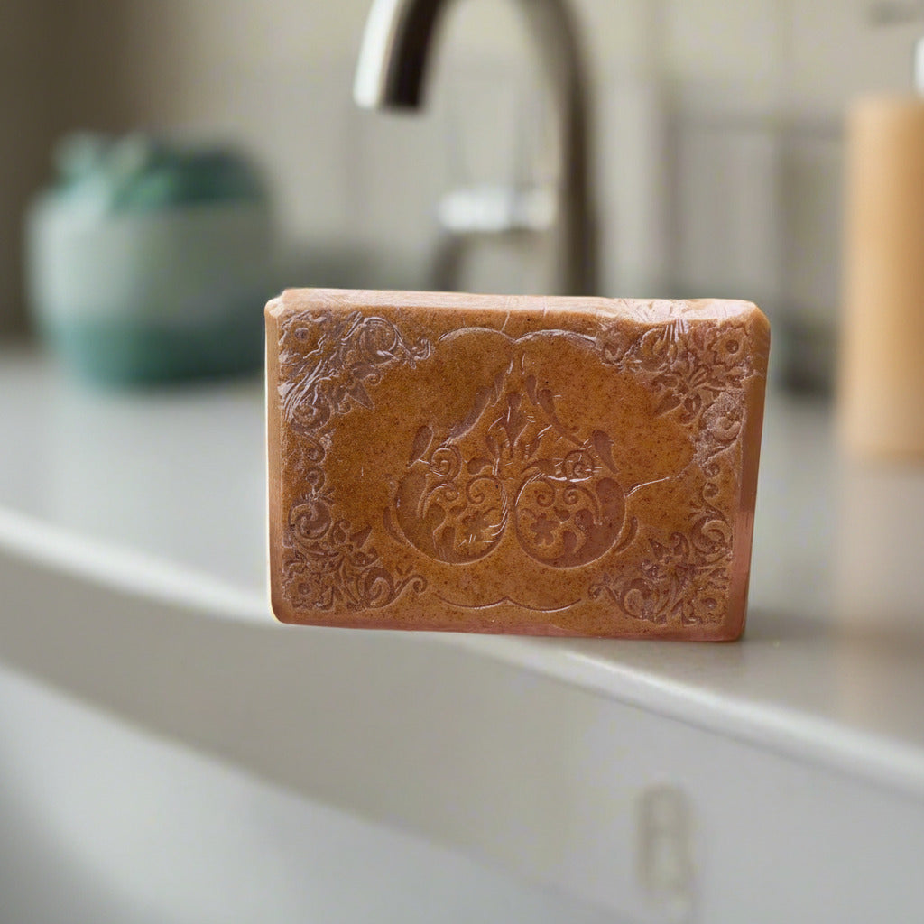 LorJas Handmade 'Turmeric Vanilla' scented goat milk soap with bathroom countertop background