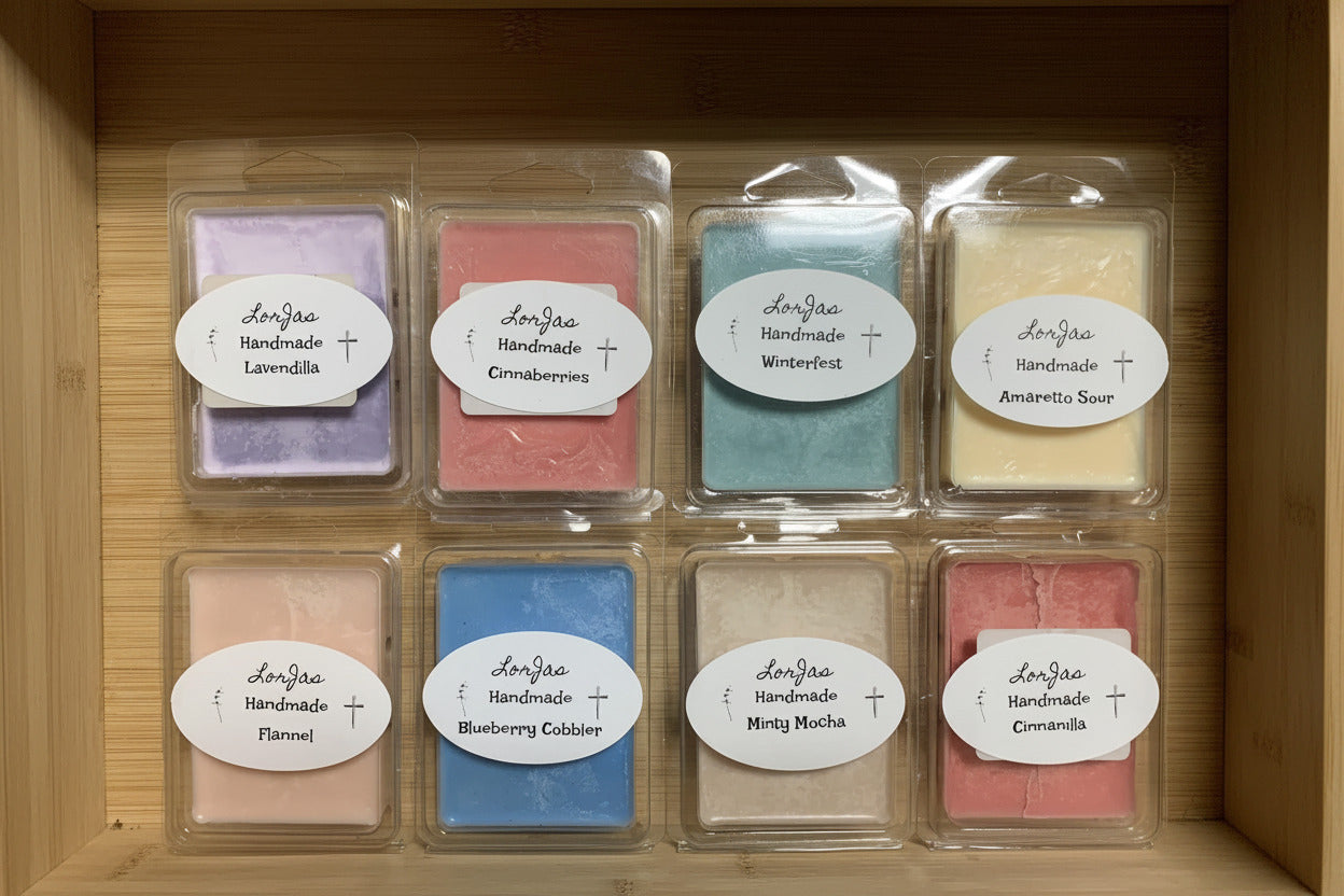 Sample set of LorJas Handmade organic soy scented wax melts in labeled packaging in wooden display box.