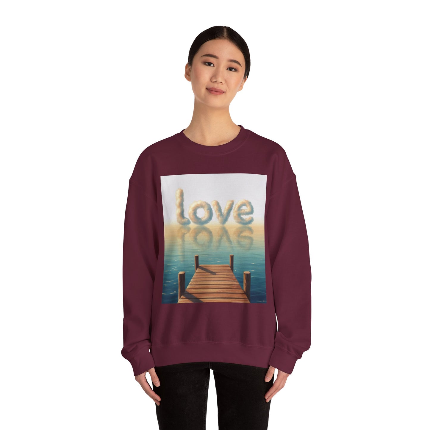Person wearing a maroon sweatshirt with a 'love' graphic design on a white background