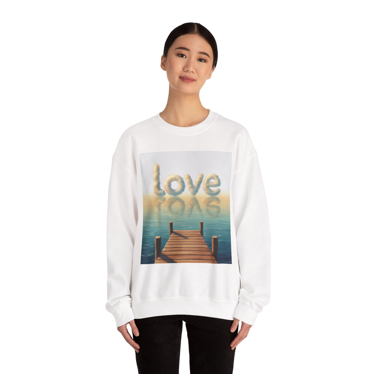 Person wearing a white sweatshirt with a 'love' graphic design on a white background