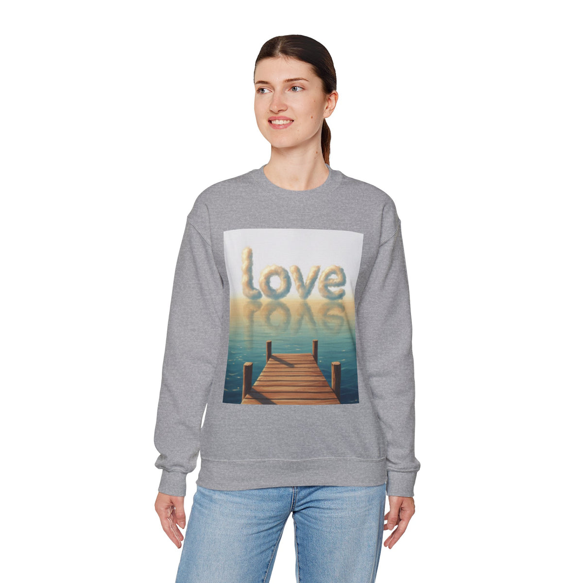 Woman wearing a gray sweatshirt with a graphic design and text on a white background