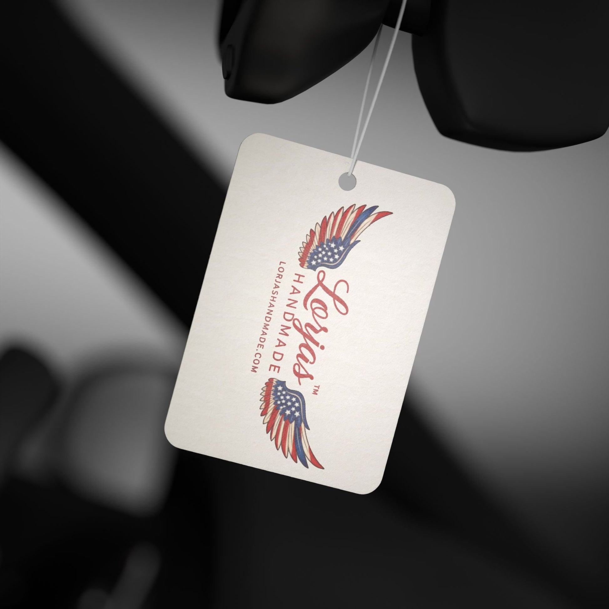 LorJas Handmade branded air freshener with American flag design on a dark background