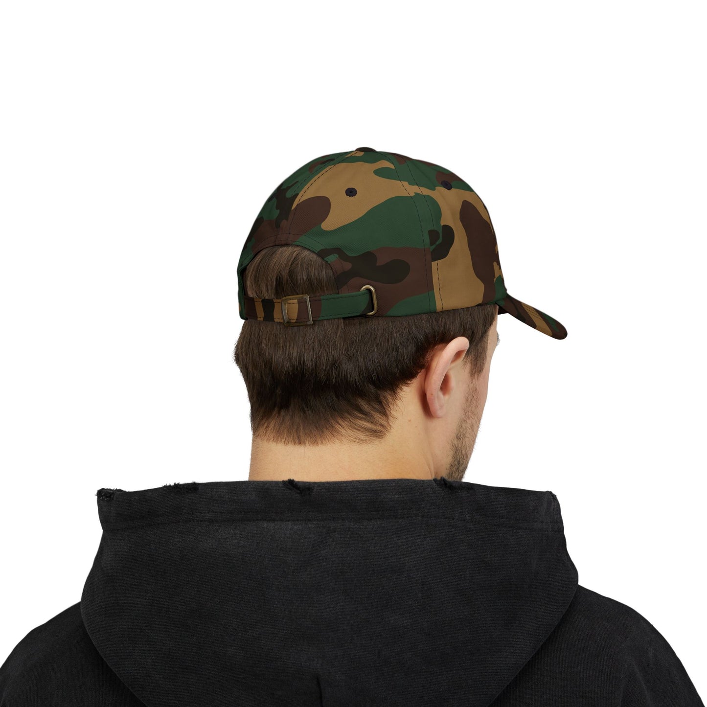 Person wearing a camouflage baseball cap on a white background