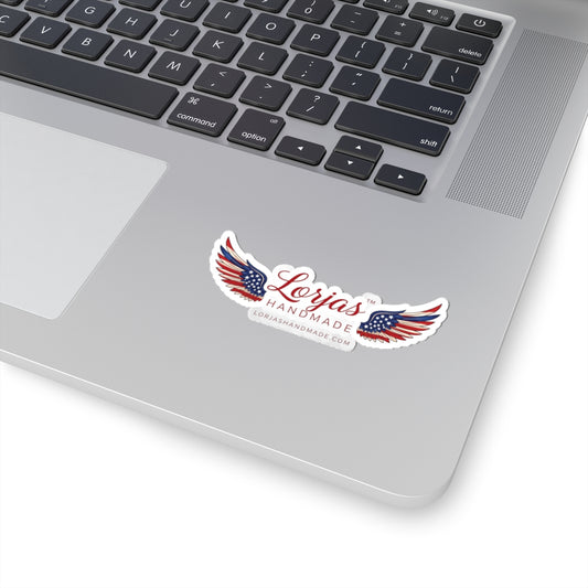 Laptop with a sticker featuring 'Lorjas Handmade' design on a white background