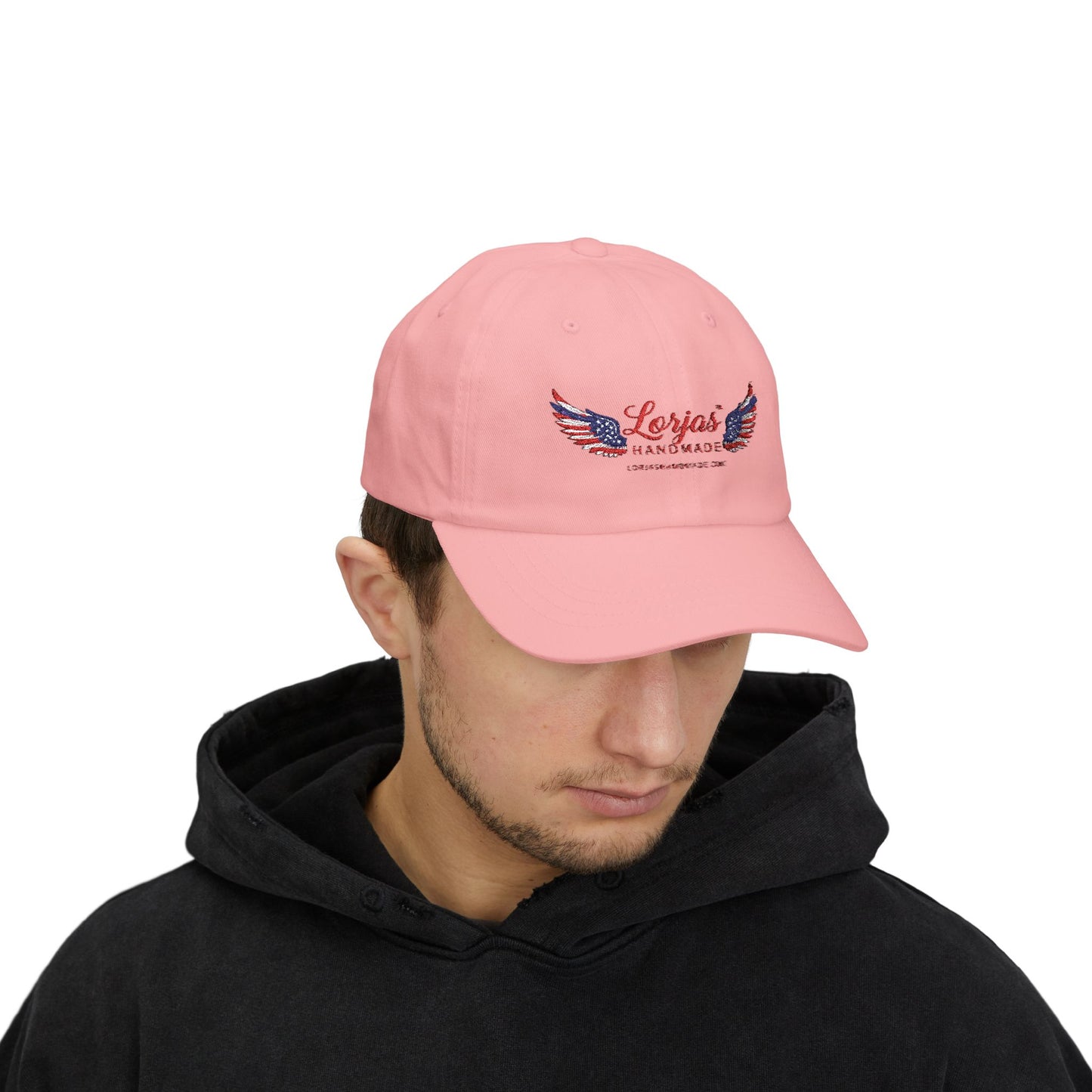 Male model wearing a pink cap with 'LorJas Handmade' brande logo on a white background