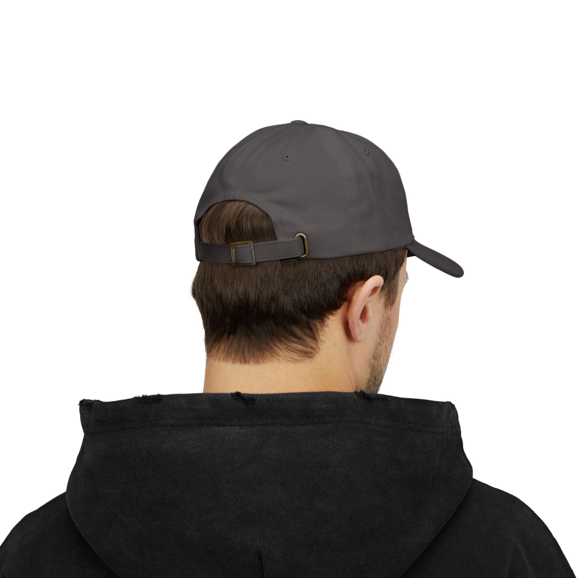 Person wearing a dark gray cap and black hoodie on a white background