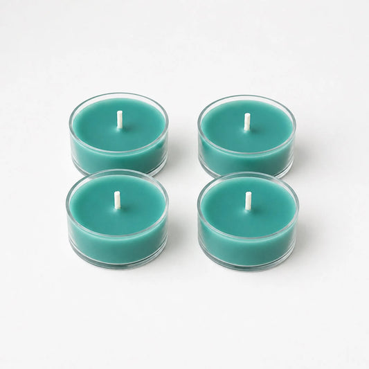 Four teal LorJas Handmade lightly scented soy tealights on a white background featuring LorJas Handmade brand logo.