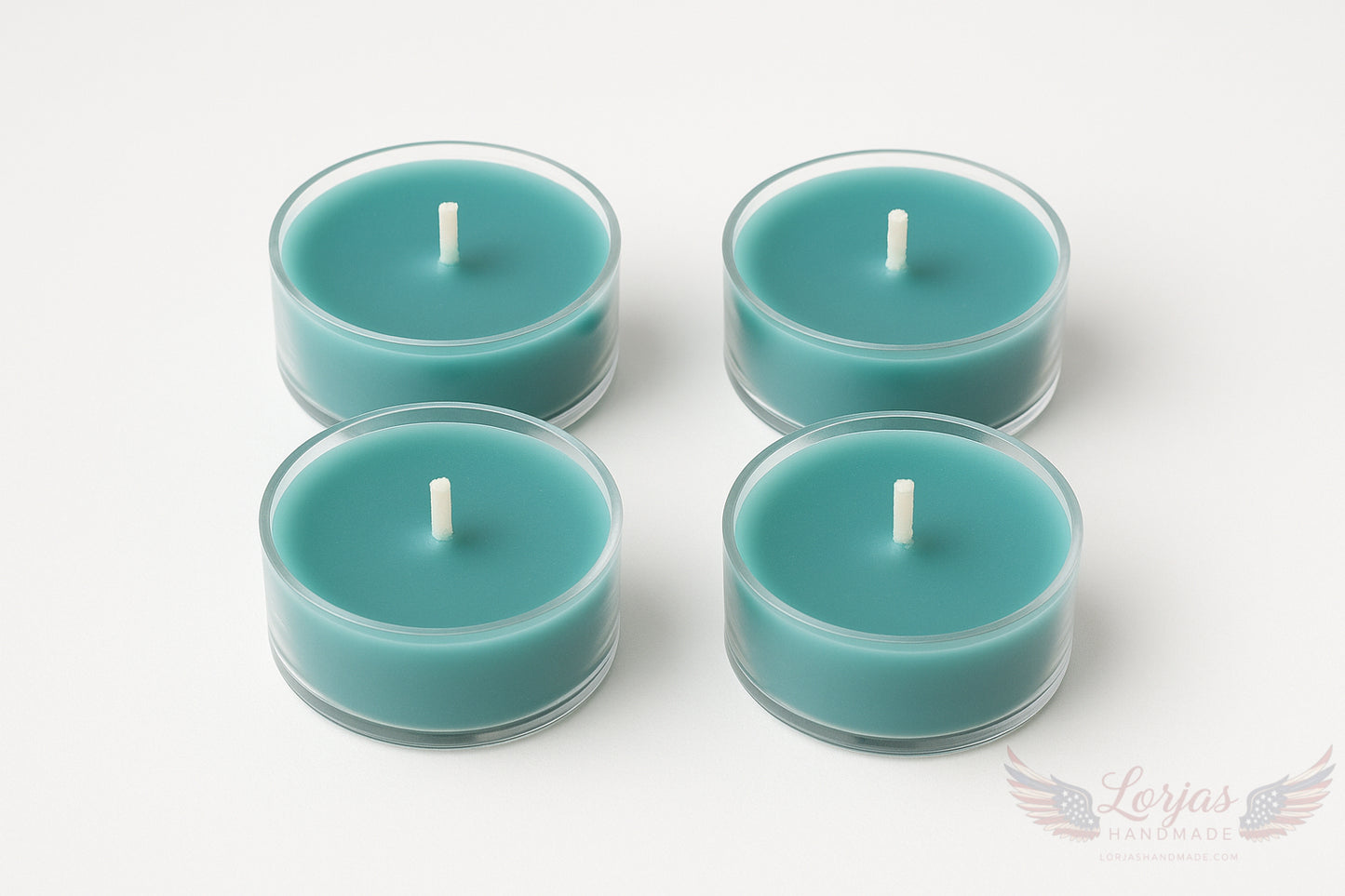 Four teal unlit tealights in clear holders on a white background with LorJas Handmade logo in corner