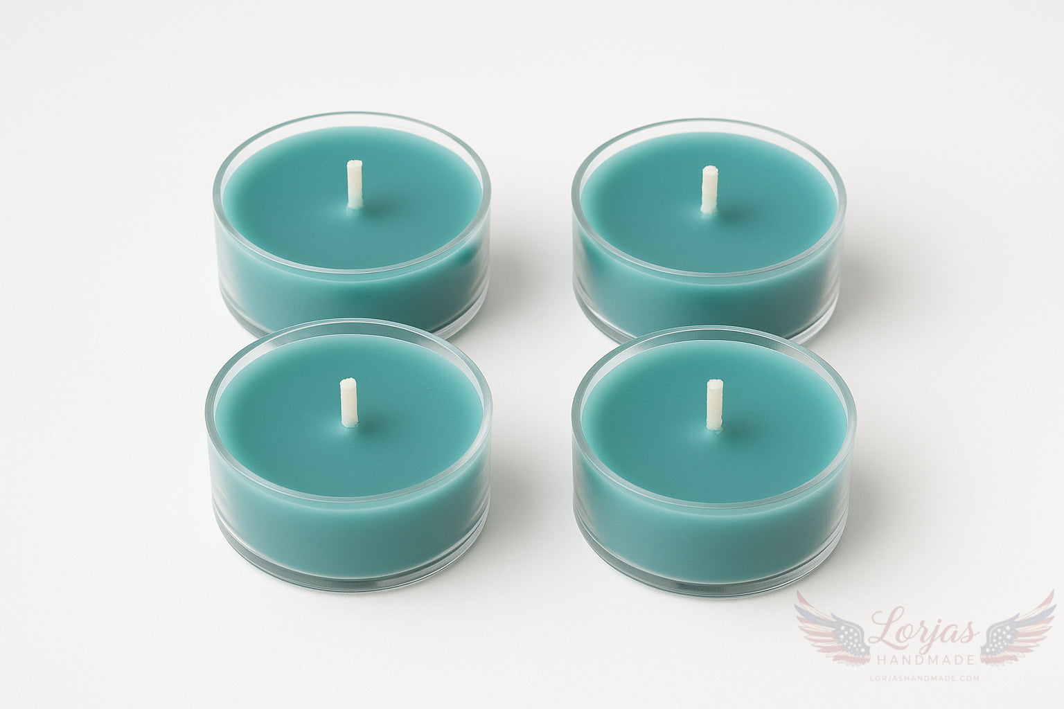 Four teal unlit tealights in clear holders on a white background with LorJas Handmade logo in corner