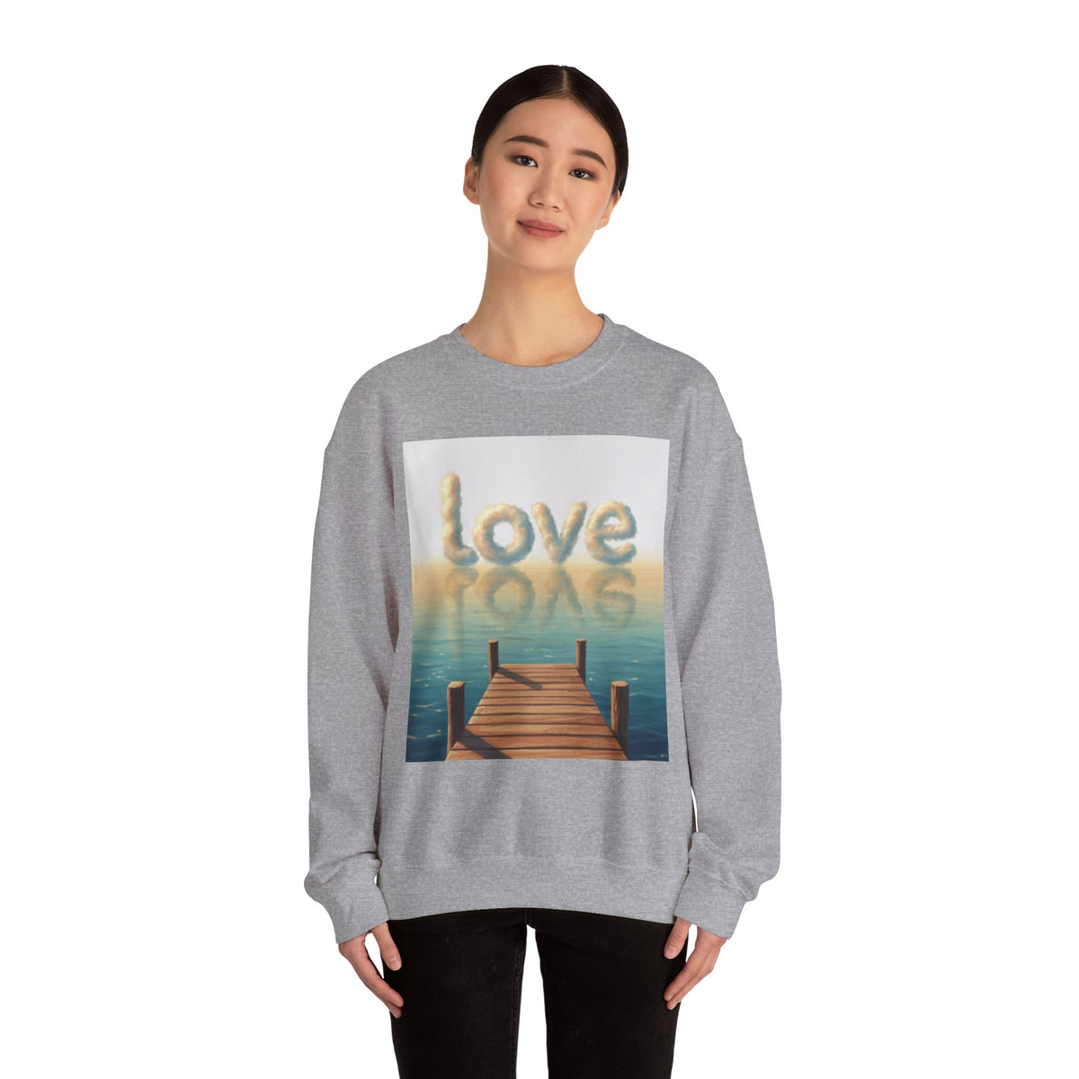 Person wearing a gray sweatshirt with a 'love' graphic design on a white background
