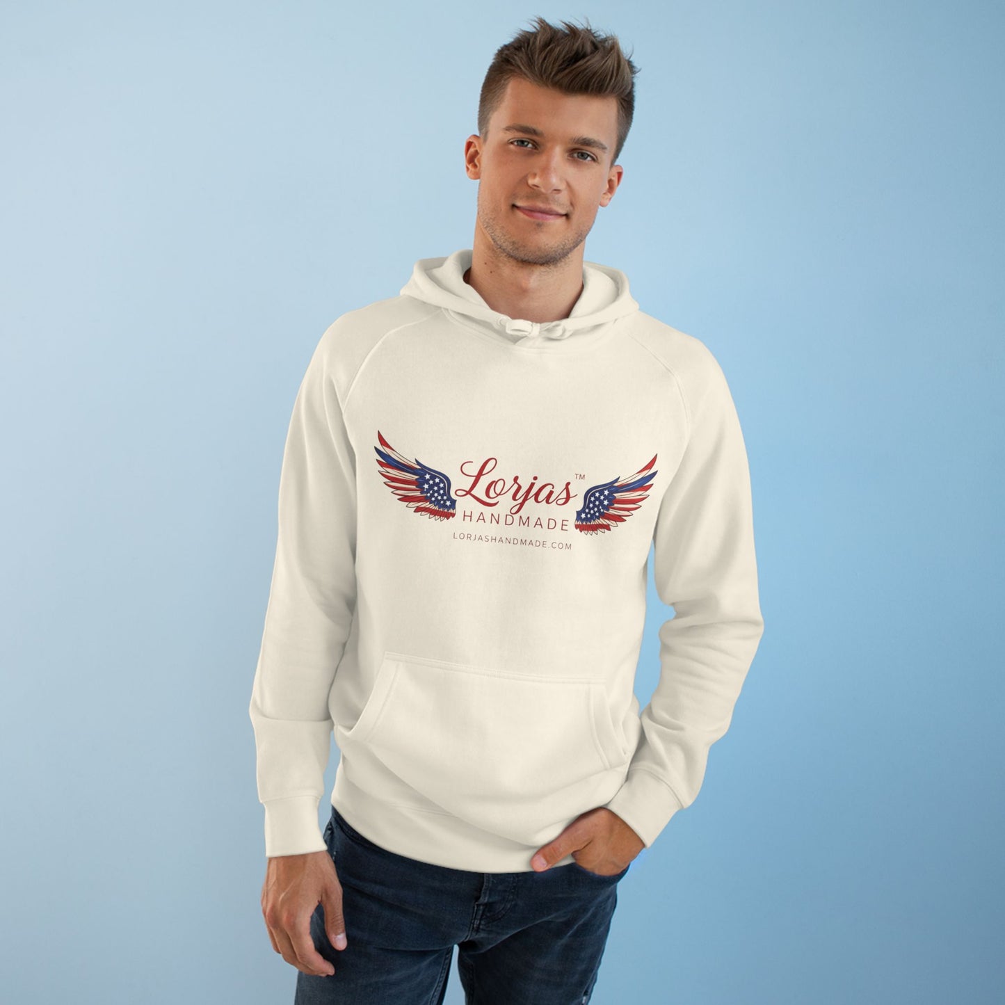 Man wearing a white hoodie with 'Lorjas Handmade' logo on a light blue background