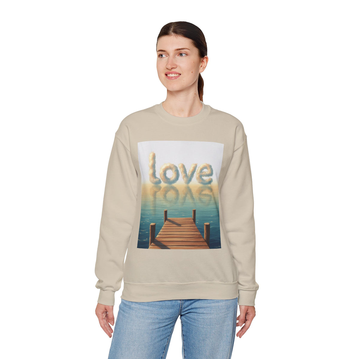 Woman wearing a beige sweatshirt with a graphic design and text on a white background