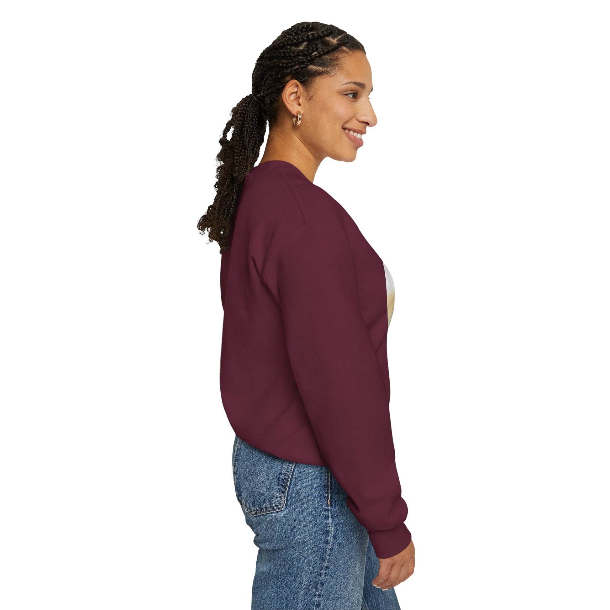 Woman wearing a maroon sweatshirt with a graphic design on the front, standing against a white background.
