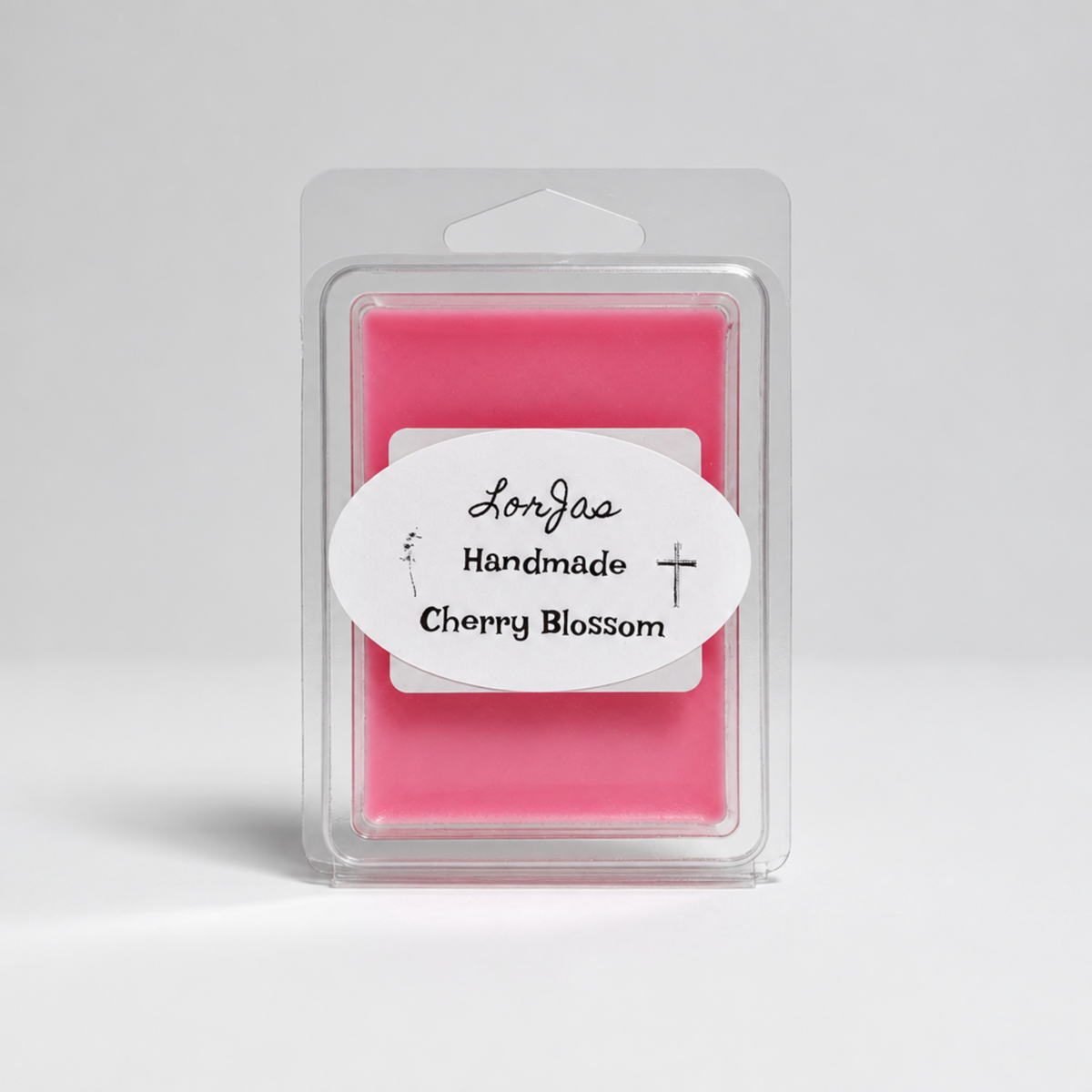 Pink Lor'Jas Handmade Cherry Blossom lightly scented soy wax melt in brand packaging with studio background.