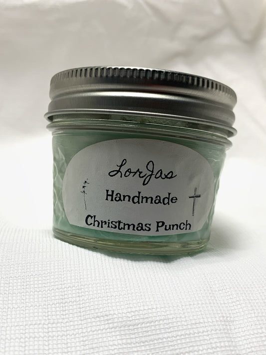 Jar of LorJas Handmade 'Christmas Punch' scented organic soy candle with a label on a white background