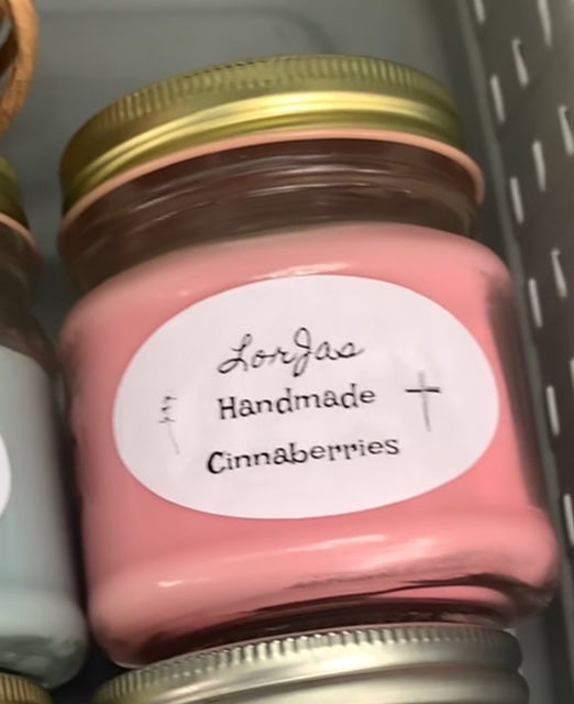 LorJas Handmade 'Cinnaberries' scented organic soy candle with label on a gray background
