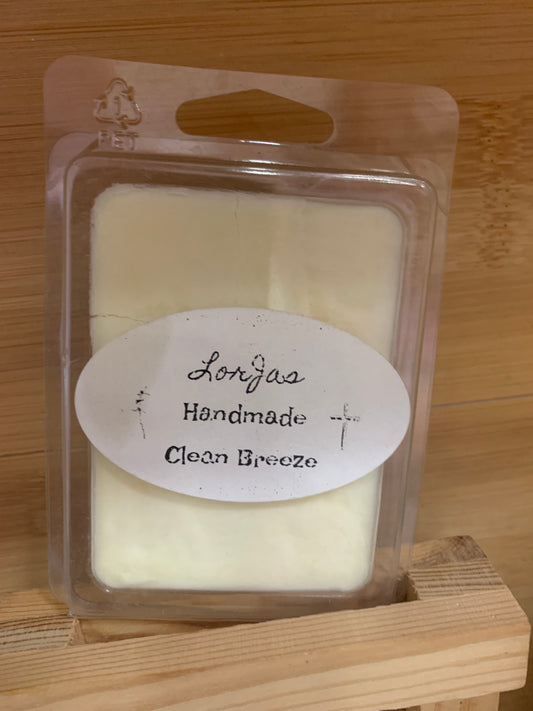 LorJas Handmade 'Clean Breeze' scented organic soy wax melt in clear packaging with a label on a wooden surface
