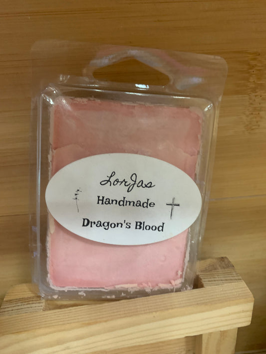 LorJas Handmade 'Dragon's Blood' scented organic soy wax melt in clear packaging with a label on a wooden surface