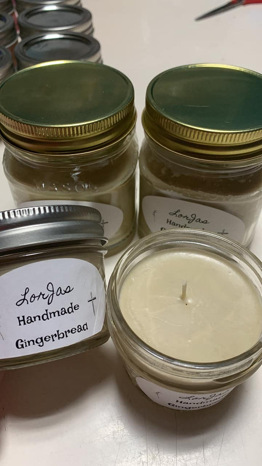 LorJas Handmade 'Gingerbread' scented organic soy candles in jars with gold lids on a white surface.