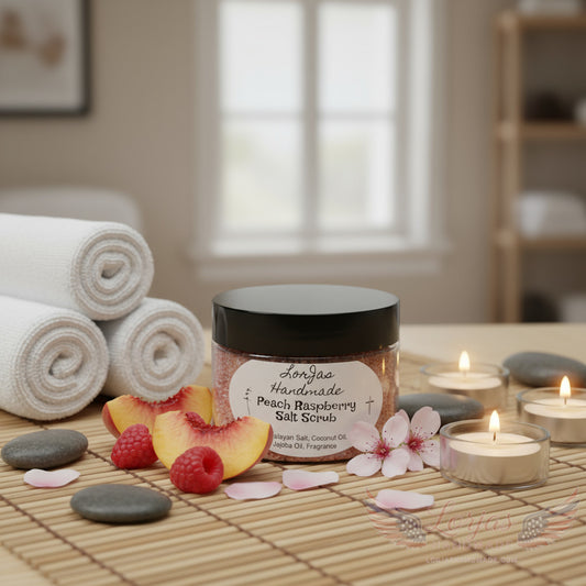 LorJas Handmade Peach Raspberry salt scrub on counter with fresh peaches and jasmine flowers with rolled towels in spa setting.