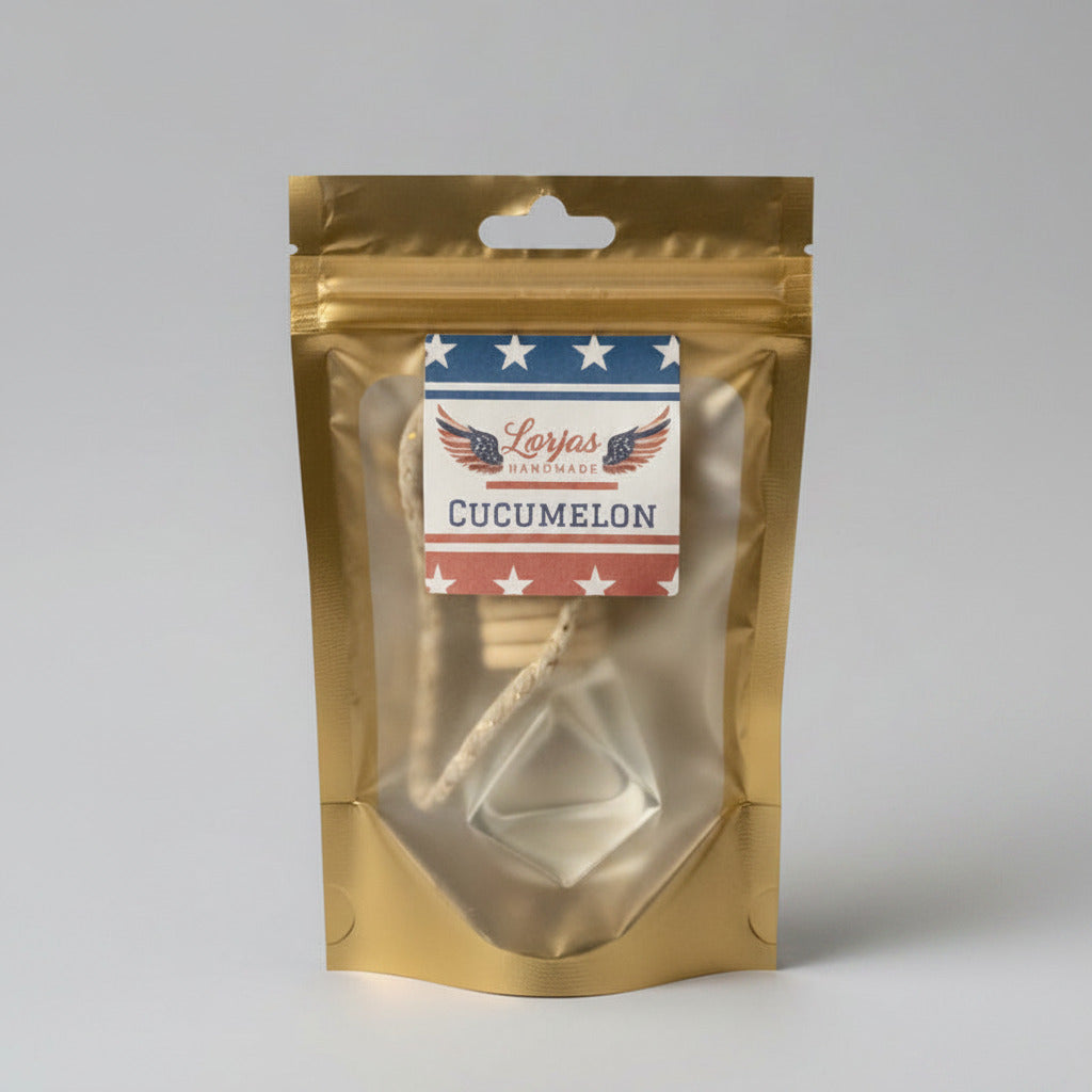 LorJas Handmade Cucumelon lightly scented car diffuser in gold branded packaging in a studio setting.