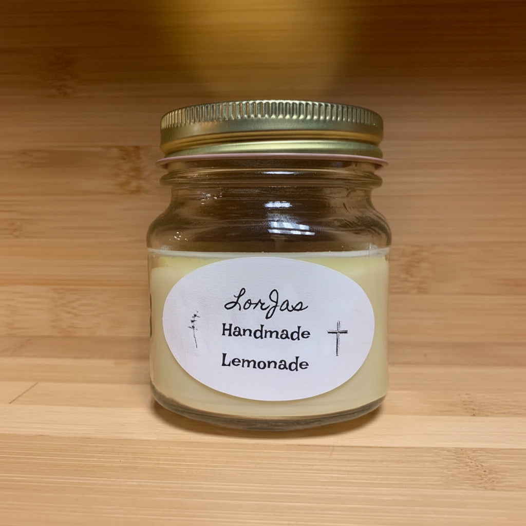 LorJas Handmade Lemonade lightly scented soy candle in a wooden display at outdoor market.