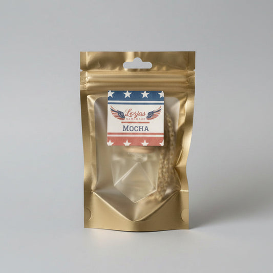 LorJas Handmade Mocha lightly scented car diffuser in gold branded packaging in a studio setting.