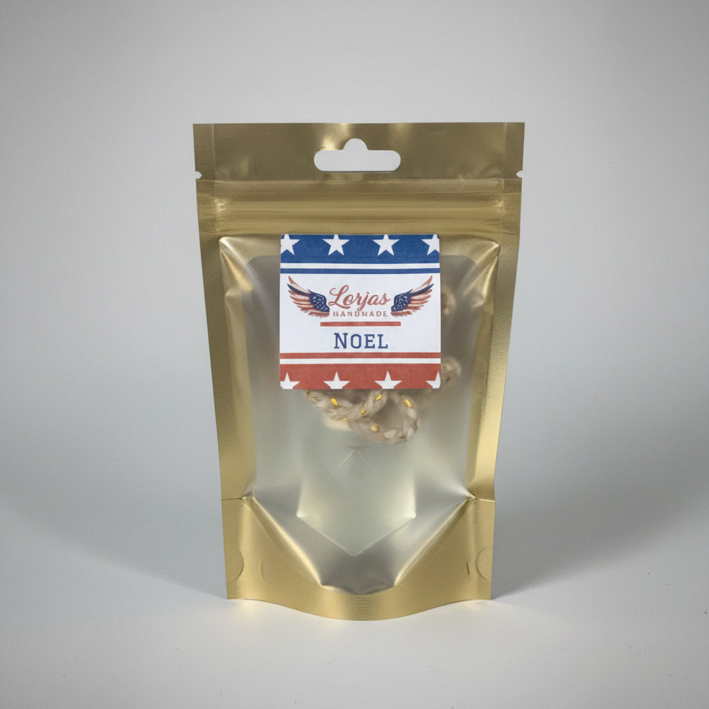 LorJas Handmade Noel lightly scented car diffuser in gold branded packaging in a studio setting.