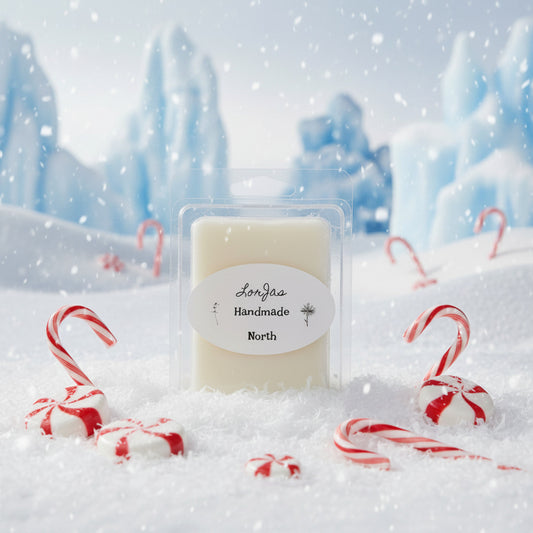 LorJas Handmade North lightly scented soy wax melt with peppermint candies in a snowy background.
