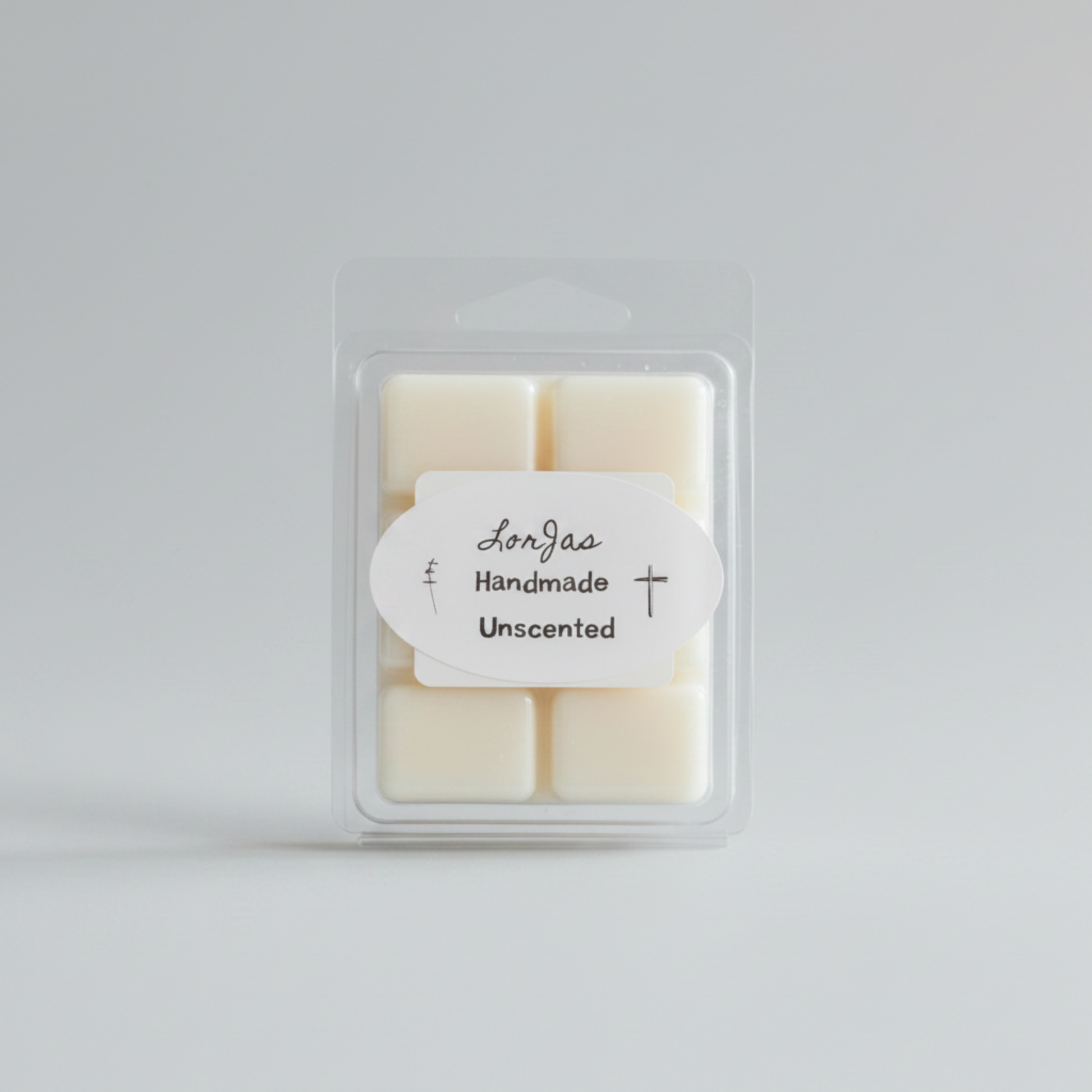 A clear plastic clamshell package containing an unscented soy wax melt, with a white oval label reading 'LorJas Handmade Unscented' on a light gray background.