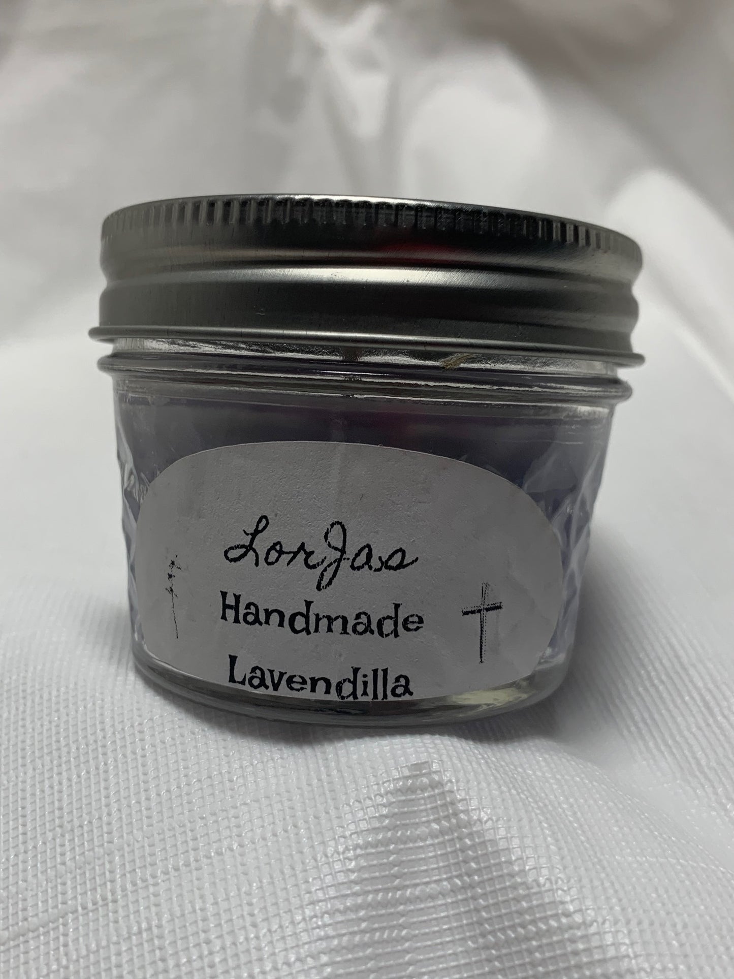 Jar of LorJas Handmade 'Lavendilla' scented organic soy candle with a label on a white background