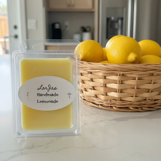 Packaged LorJas Handmade 'Lemonade' scented organic soy wax melt with a basket of lemons on a kitchen counter