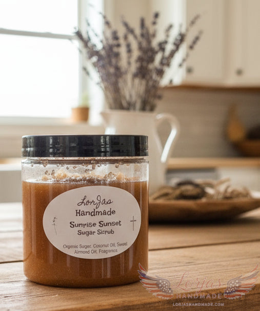 Jar of LorJas Handmade Sunrise Sunset sugar scrub on a wooden surface with a blurred background