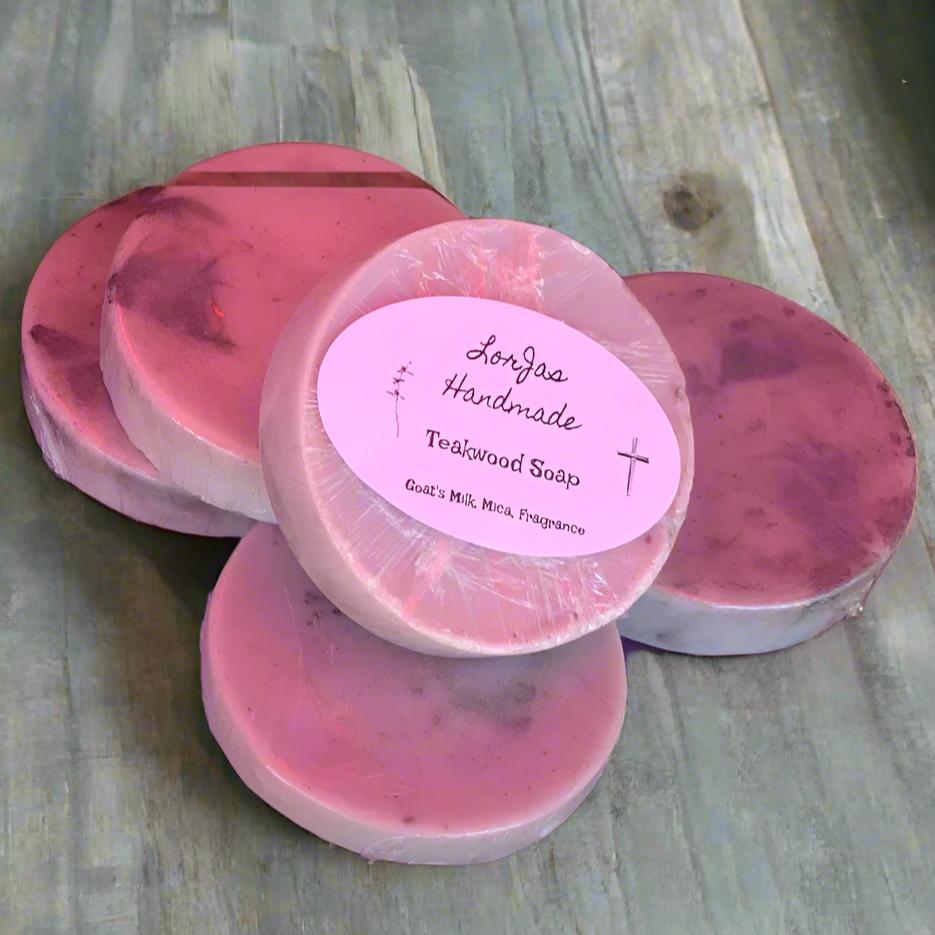 Five bars of LorJas Handmade 'Teakwood' scented organic goat milk soap with grey woodgrain background