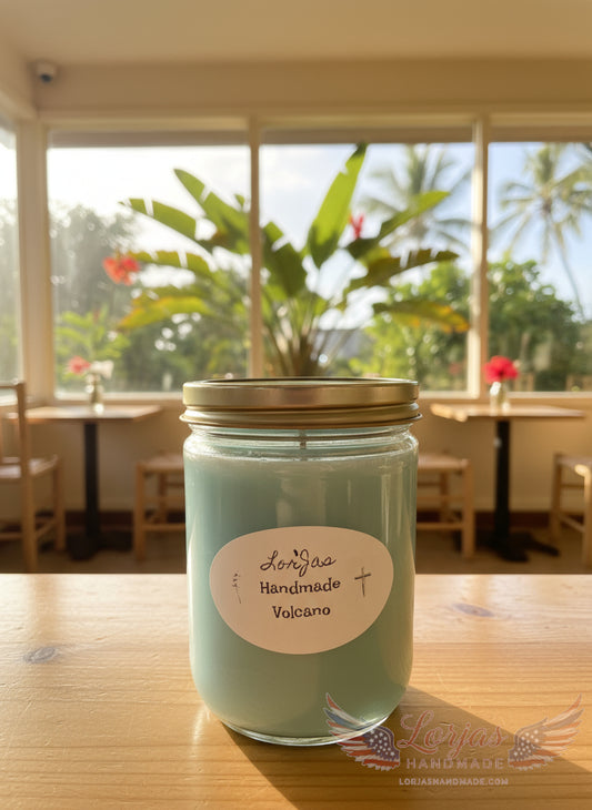 Jar of LorJas Handmade Volcano scented soy candle on a table with a scenic background