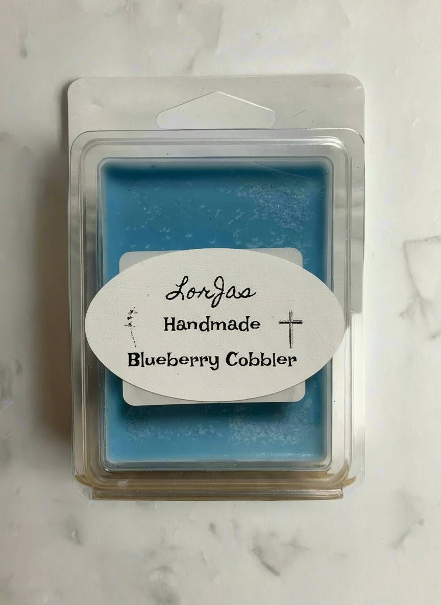 LorJas Handmade 'Blueberry Cobller' scented organic soy wax melt in clear branded packaging on a marble surface