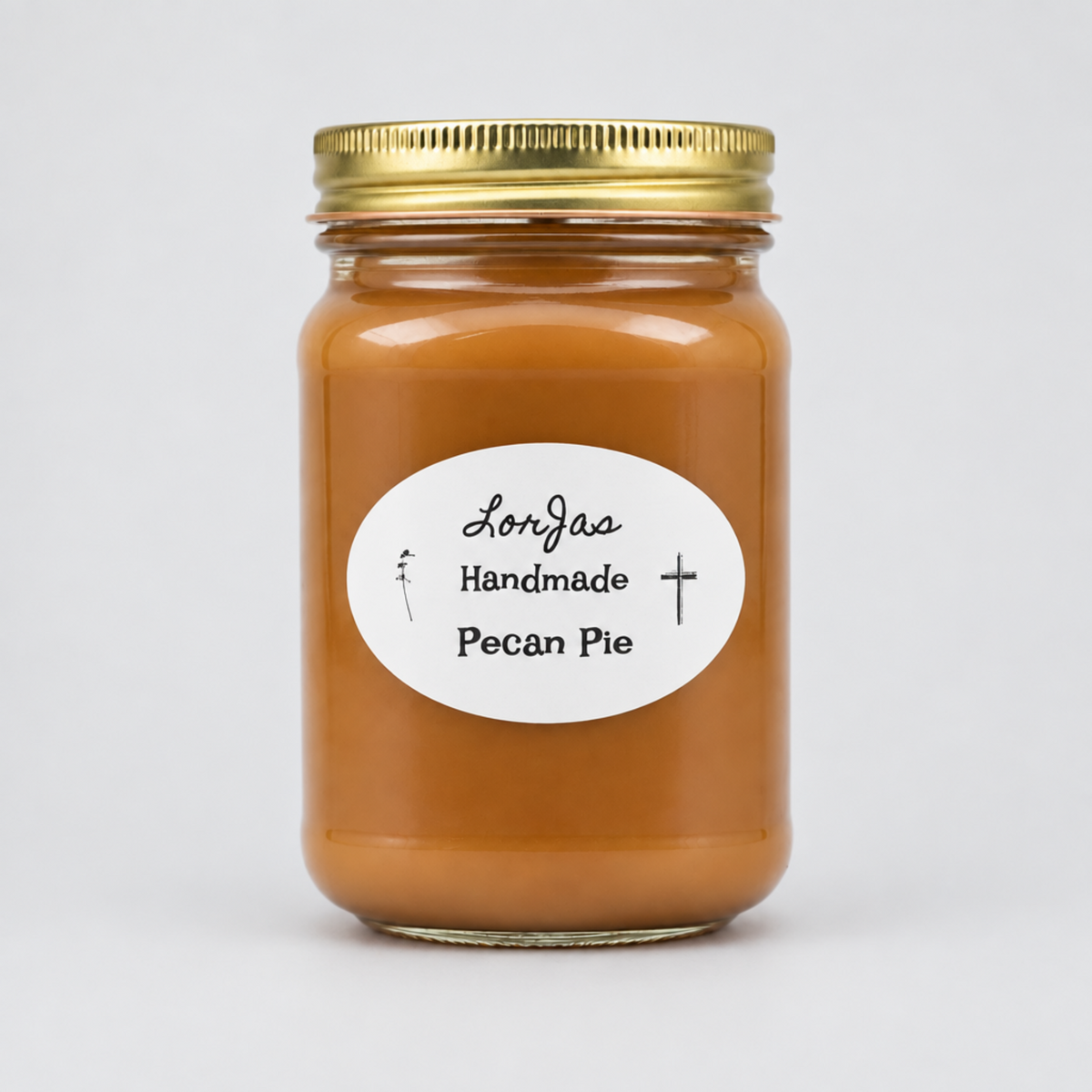 A glass jar filled with pecan pie lightly scented soy candle, sealed with a gold metal lid and featuring a white oval label that reads 'Lor'Jas Handmade Pecan Pie' on a light gray background.