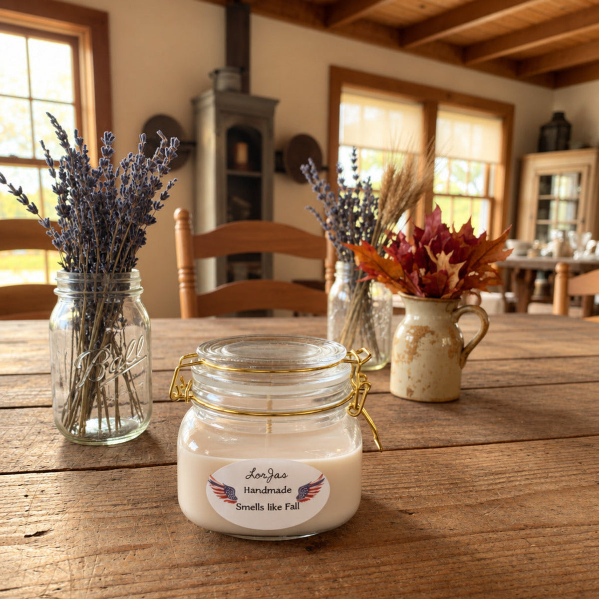 Jar of LorJas Handmade Smells Like Fall scented candle with decorative elements on a wooden table