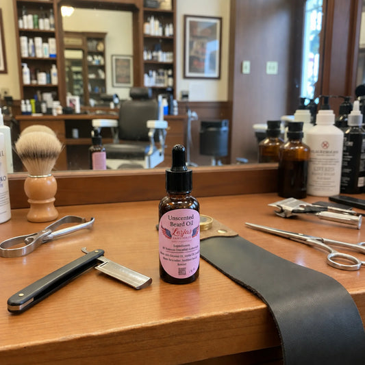A small amber dropper bottle labeled 'Unscented Beard Oil' sits on a wooden barbershop counter surrounded by grooming tools and products, with a mirror and salon interior in the background.